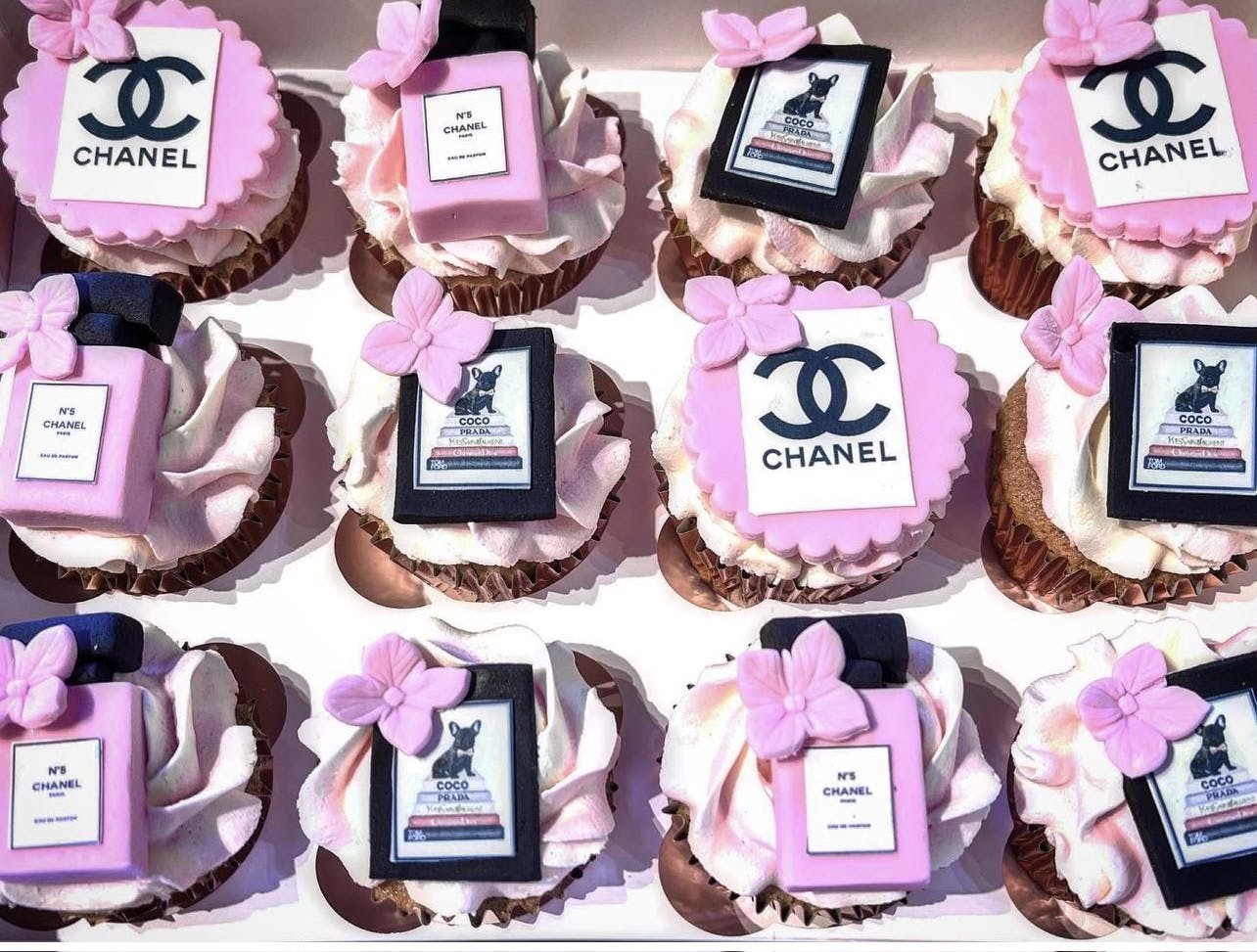 Cupcakes with Chanel Paris perfume bottles made out of fondant on top