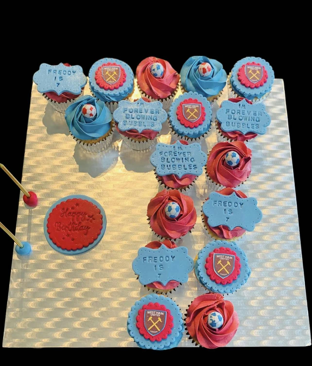 Cupcakes in the shape of the number seven with blue and red toppings and West Ham United logos